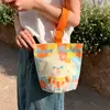 Venta al por mayor del fabricante Bolso de mano artístico de moda Bolso de lona Bolso tipo cubo de gran capacidad para mujer 2026 Nuevo Bolso para almuerzo de trabajo