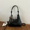Tendência minimalista transfronteiriça outono 2026 nova moda bolsa de trabalho feminina casual personalizada bolsa de ombro transversal