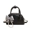 Bolso de mano único, casual y elegante, tipo concha para mujer, nuevo modelo primavera 2026, bolso de hombro y cruzado de lujo ligero de alta calidad
