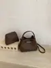 Bolso de mano de alta gama transfronterizo para mujer, nuevo bolso tipo cubo simple de moda, bolso cruzado y de hombro casual para el día a día, moderno
