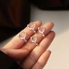 Aretes redondos de cuentas para mujer invierno 2023 nuevo diseño de temperamento moderno estilo frío combinable aretes simples venta al por mayor de fábrica