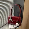 Bolsa de ombro versátil nova para o outono de 2026, bolsa de ombro de nicho moderna e estilosa, bolsa de mão de alta qualidade