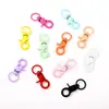 Accesorios de llavero de pintura de color diy al por mayor hebilla de pinza color macarrón hebilla de perro de aleación hebilla colgante para equipaje