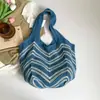 Bolso de Hombro Individual Calado Tejido para Mujer Primavera 2026 Nuevo Bolso Tejido Rayado Casual de Gran Capacidad para Vacaciones en la Playa Estilo Simple