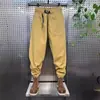 Macacão Masculino Moda Marca 2024 Verão Nova Chegada Calça Casual de Pernas Soltas Versátil Verde Militar Moda Nacional Bonito Calça Harem