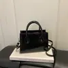Verão 2026 Novo Estilo Simples Moda High-End Versátil Elegante Bolsa de Ombro Único Transversal de Mão Pequena Quadrada Transfronteiriça