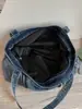 Bolso de mezclilla de gran capacidad, nuevo bolso de mano casual para el verano 2026, bolso tote de estilo relajado para mujer