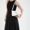 2025 Nueva Moda Color Sólido Francés Nicho Casual Bolso Baguette Debajo del Brazo Bolso de Mano para Mujer Elegante Bolso de Hombro Cruzado