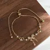 Joyería de Lujo Ligero con Circonita Incrustada Bañada en Oro Real para Mujer Sensación de Alta Gama Pulsera de Tipo Ajustable con Nudo de Lazo Pulsera de Muñeca Venta al por Mayor