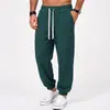 Coleção masculina nova AliExpress transfronteiriça: calças casuais de tecido canelado e sedoso, calças retas de corte solto com listras verticais e bolsos grandes