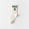 Calcetines de algodón para mujer de otoño e invierno de 168 pines con letras N cara sonriente calcetines para mujer desodorantes absorbentes de sudor calcetines cortos suelas elásticas de moda