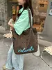 Bolso de lona con estampado de leopardo de gran capacidad para mujer, nuevo 2025, bolso de hombro versátil casual vintage de principios de otoño, bolso de mano para el trabajo