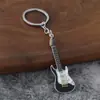 Novo chaveiro pingente de guitarra transfronteiriço, pingente criativo de instrumento musical, liga de zinco DIY decoração para mochila de estudante
