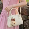 Bolsa de almohada transfronteriza para mujer 2026 Nuevo estilo Moda Popular Temperamento Bolsa de boliche Elegante Bolso de mano para hombro Cruzado Moderno