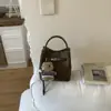 Bolsa de Mão Retrô Transfronteiriça para Mulheres Moda Primavera 2026 Bolsa Saco Design de Nicho Bolsa Transversal para Mulheres Conjunto