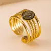 Estilo europeo y americano, anillo ligero de acero inoxidable de lujo para mujer, con un diseño bohemio de múltiples hilos, una piedra natural de forma ovalada y un acabado hecho a mano.