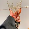 Carrillón de Viento de Mariposa Borla Pasador de Pelo de Perla para Mujer 2026 Nuevo Popular Pasador Exquisito de Gama Alta Nicho Accesorio para el Cabello