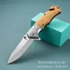Navaja plegable multifuncional portátil transfronteriza de oro-titanio para camping al aire libre, cuchillo para pelar y tallar frutas de alta dureza