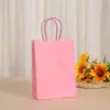 Bolsa de papel kraft blanco para llevar al por mayor color bolsa de papel con asa de cuerda bolsa para empaque de regalos de ropa de repostería