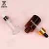 Botella de aceite marrón de 30 ml, botella transparente esmerilada de hombro plano, fondo de rejilla, botella con gotero redondo recto, botella de spray, embotellado