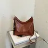 Nueva colección otoño/invierno 2026: Bolso de mano coreano simple, retro, moderno y versátil con un toque de alta gama, diseñado para mujeres, y se puede llevar como bandolera o bolso de hombro