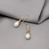 Pendientes de perla minimalistas de lujo estilo Ins Moda europea y americana de moda Perla de concha aleación de perla Venta caliente transfronteriza Temu