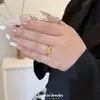 Anillo mariposa con diseño de moda ins punto oro arena diamante cepillado anillo para dedo de moda de lujo ligero lindo sensación de alta gama diseño