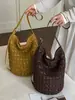 Bolso de mano tejido a mano de rafia estilo coreano de nicho para mujer 2026 Nuevo estilo de vacaciones de verano Bolso de axila de playa