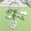 Diseño Creativo Plata Vintage Saxofón Cinta Musical Llavero Transfronterizo Más Vendido Colgante de Bolsa Pequeño Accesorio
