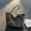 Bolso de gamuza para mujer 2026 nuevo de moda otoño de alta gama vintage para el trabajo bolso tote de gran capacidad bolso de hombro