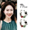 Los mismos pendientes florales de estilo que lleva Jiang Yan del restaurante chino, pendientes largos de borla estilo resort bohemio, pendientes de botón vintage de alta gama
