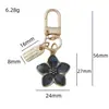 Chaveiro Pingente Flor de Esmalte em Liga Metálica Transfronteiriço Doce e Fofo Flor de Cerejeira Flor de Ameixa Decoração para Bolsa Capa de Fone de Ouvido