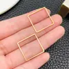 Acero Inoxidable Grande Electrochapado al Vacío Dorado Borde Geométrico Calado Trébol de Cuatro Hojas Símbolo del Infinito Accesorios para Joyería DIY