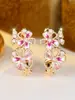 Pendientes de flor y mariposa con goteo de aceite, superventas transfronterizos para mujer, pendientes florales huecos incrustados con diamantes rosas de lujo ligero