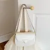 Bolso de sillín de cuero suave de alta gama para mujer, nuevo y moderno bolso tejido para hombro o axila 2026, bolso con solapa, bolso cruzado de moda