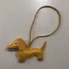 2024 nuevo cuero lindo perro salchicha colgante llavero cachorro colgante bolsa colgante caricatura colgante al por mayor