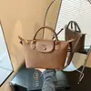 Bolso tote tejido con textura de alta calidad transfronterizo para mujer, nueva colección otoño 2026, versátil para el trabajo y el uso diario, bolso de hombro o bolso cruzado