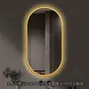 Espejo de baño inteligente ovalado en stock con lijado exterior e iluminación LED translúcida, adecuado para montaje en pared de baño y proyectos hoteleros, con opciones de personalización.