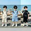 Conjunto de Ropa de Verano para Niños 2026 Nuevo Estilo Lindo Bebé Bolso Cruzado Manga Corta Pantalones Cortos Estilo Coreano Conjunto de Dos Piezas Venta al por Mayor