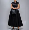 D643 Moda europea y americana para mujer, vestido largo de color liso brillante elegante con cuello en V, manga corta y bajo ancho para exportación