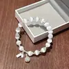 Pulsera de la suerte y auspiciosa de nuevo estilo, fresca y elegante, estilo refrescante, pulsera de borla que trae suerte, versátil para mujeres artísticas