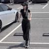 Conjunto de dos piezas moderno para 2025, de corte corto y ajustado, con cuello redondo y manga corta, nuevo de verano en negro, con pantalones casuales de pierna ancha y talle alto