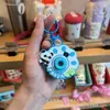 Llavero de Cámara de Proyección de Dibujos Animados Sanrio Colgante para Bolso Juguete para Niños Colgante Luminoso Pequeño Regalo Venta al por Mayor