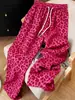 Nuevo producto de moda transfronteriza europea y americana primavera-verano: pantalones largos de pierna ancha con estampado de leopardo, cordón y bolsillos laterales, pantalones casuales de pierna ancha para mujer