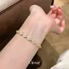 Pulsera vintage estilo palacio con cierre de corazón de circonita chapada en oro real de 18 quilates, joyería de moda exquisita transfronteriza europea y americana