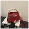 Bolsa pequena estilosa de alta qualidade para mulheres 2026 nova bolsa transversal versátil bolsa de mão super popular com fecho de trava pequena bolsa de mão