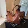 Bolsa de Ombro PU de Alta Textura Estilo Coreano Feminina 2025 Nova Cor Sólida Grande Capacidade Bolsa de Mão Versátil Bolsa Tote para o Dia a Dia