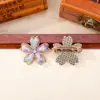 Brocado Song de cinco pétalos de flor de cerezo acabado en el pecho puntada colorida tela de brocado Song broche de flor de cerezo de aleación accesorios de ropa de estilo antiguo lote mixto
