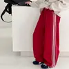 Pantalones deportivos de otoño e invierno para niñas 2026 casual estilo coreano con forro polar engrosados holgados de pierna ancha para niños mayores