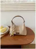 Bolso de axila tejido de nicho de verano para mujer 2026 Nuevo bolso de mano de moda Bolso tejido de paja Bolso versátil de hombro y cruzado